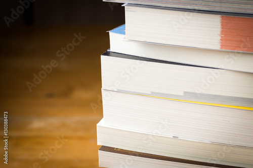 close up book stack on wood table