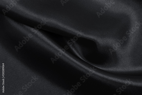 Smooth elegant dark grey silk or satin texture as abstract backg
