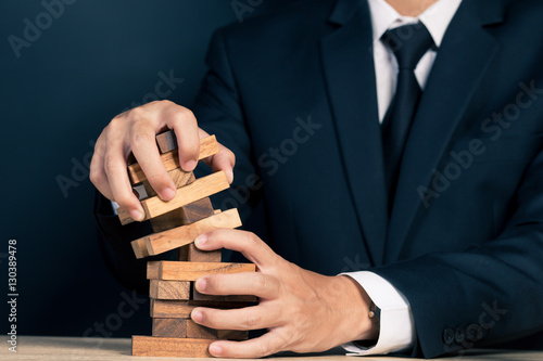 Businessman Builds a Tower