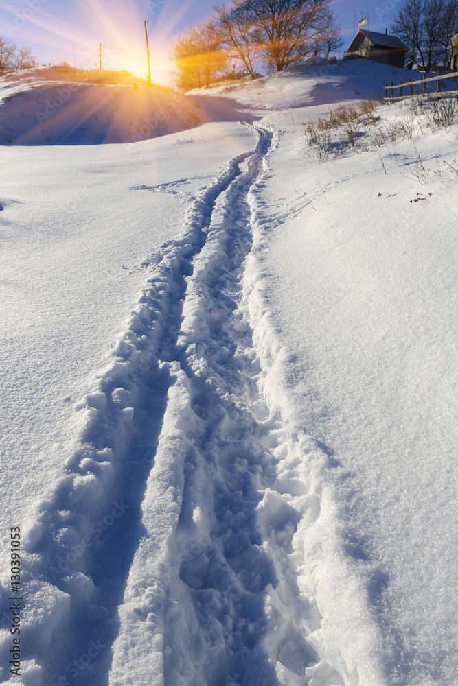 pathway on snow-covered meadow