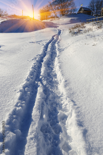 pathway on snow-covered meadow © Pavlo Klymenko