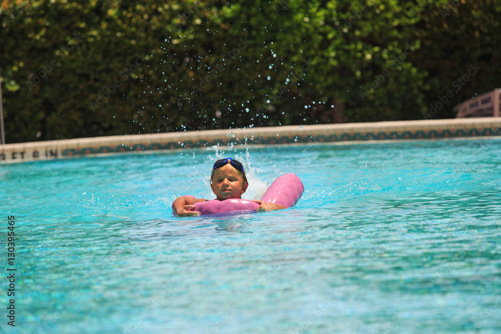little boy enjoy swimming in the pool, active kids