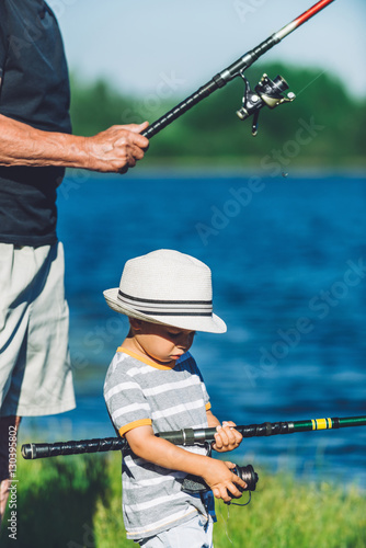 Fishing. Little boy fishing on a lake