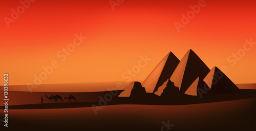 egyptian vector landscape - desert, pyramids and camels at the sunset