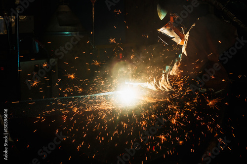 Welder arc Gouging carbon electrode rods with sparks and smoke