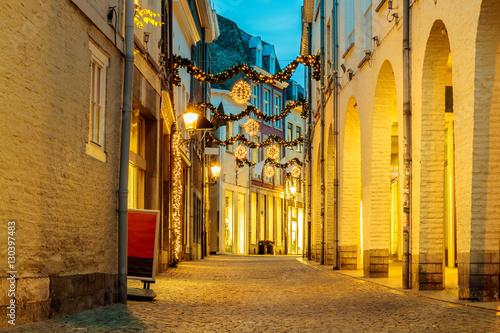 Fototapeta Naklejka Na Ścianę i Meble -  Shopping street with christmas lights in the city center of Maastricht