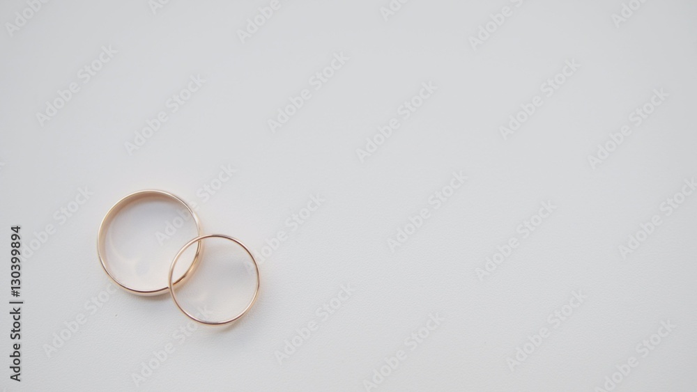 Golden wedding rings on white background Golden wedding rings on white background