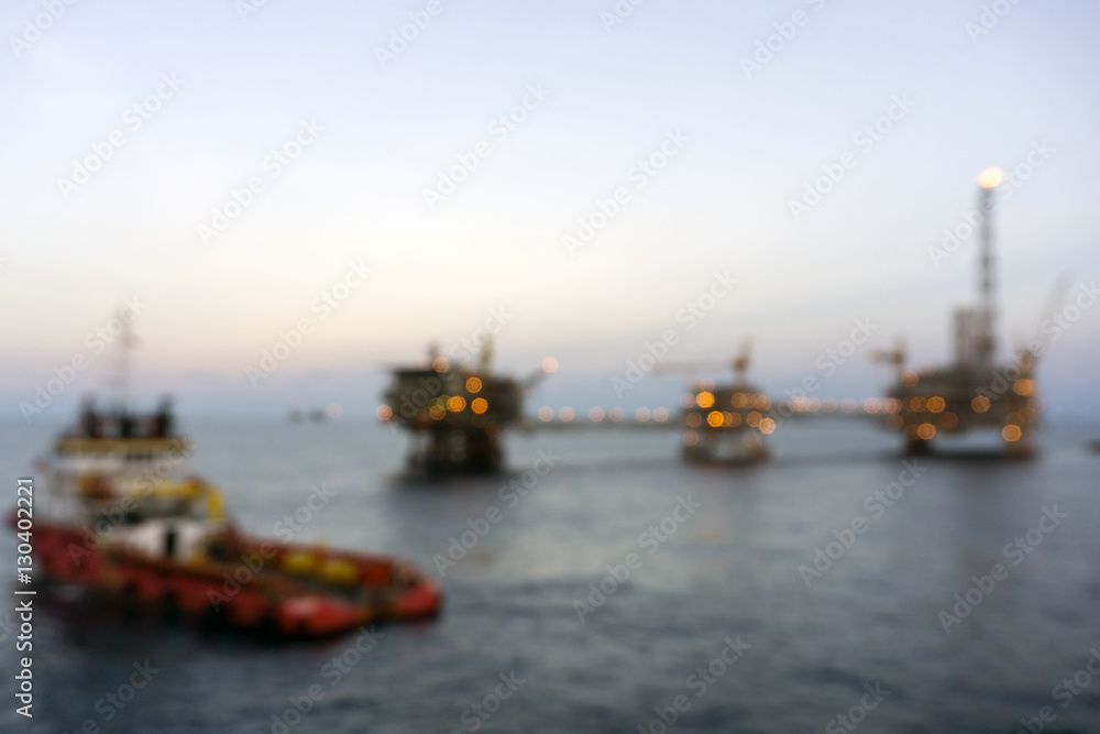 Blurry image of anchor handling tug at oil field Blurry image of anchor handling tug at oil field