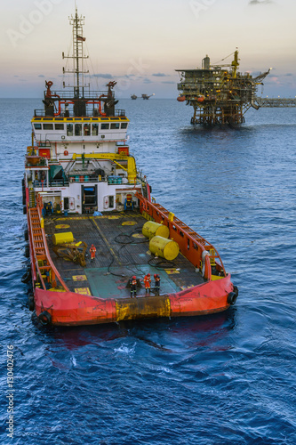 A tug boat performing anchor handling task at oil field