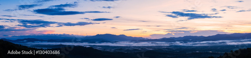 Panorama of sunrise in the mountains. © Tee11