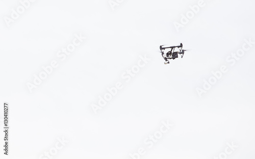 Aerial drone shooting aerial footage and aerial images while flying © Dewald