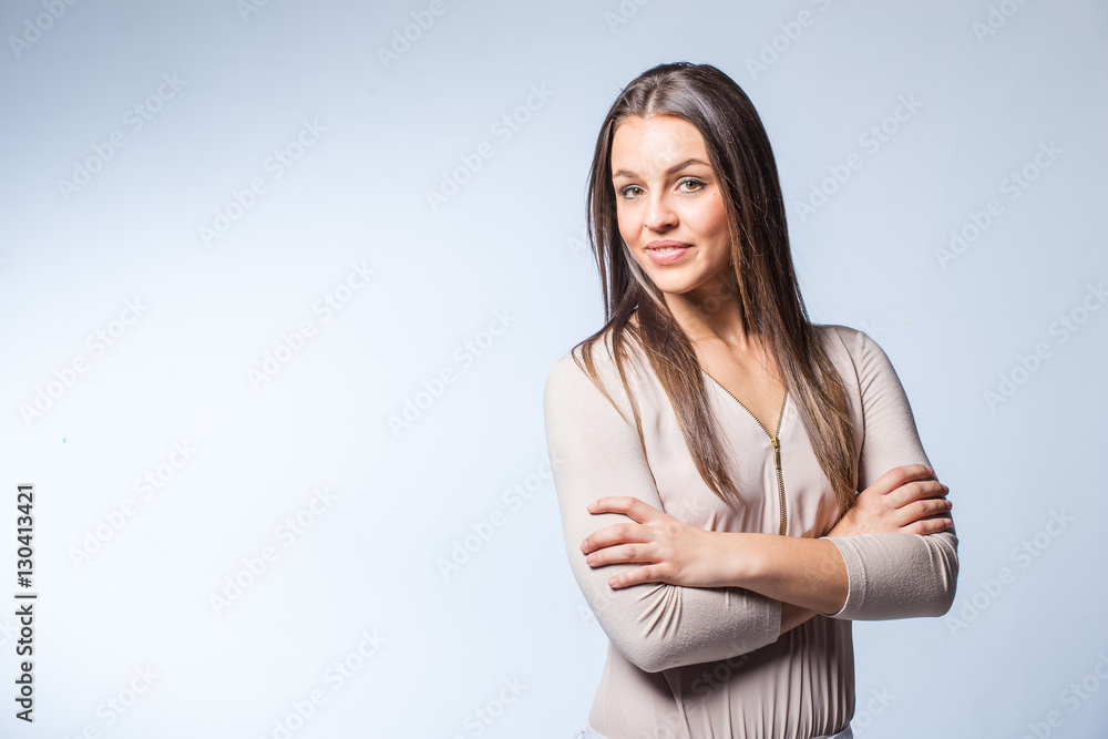 Young brunette business woman looking professional in a studio Young brunette business woman looking professional in a studio