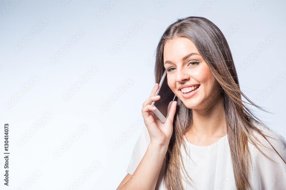 Pretty brunette business woman working on her smart phone planning business meetings or taking selfies. Pretty brunette business woman working on her smart phone planning business meetings or taking selfies.