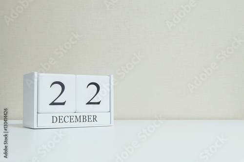 Closeup white wooden calendar with black 22 november word on blu