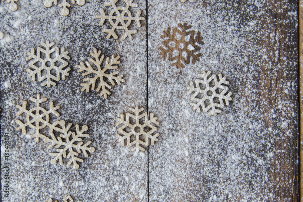 Obraz premium Snowflakes on the wooden table