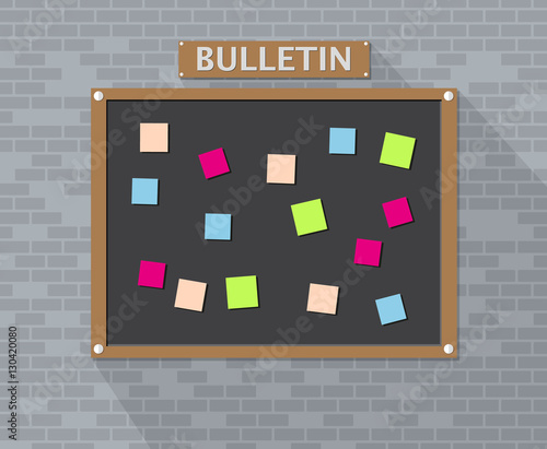 Bulletin board hanging on brick wall