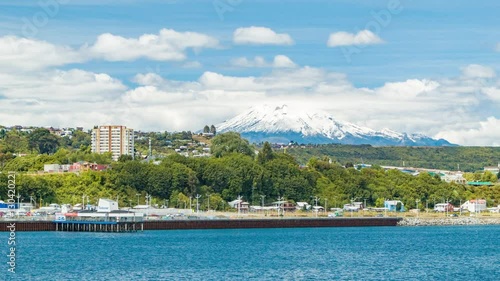 Orsorno Volcano Wide Shot with the Puerto Montt Chile Waterfront with Vibrant Colors around the Snow Capped Mountain photo