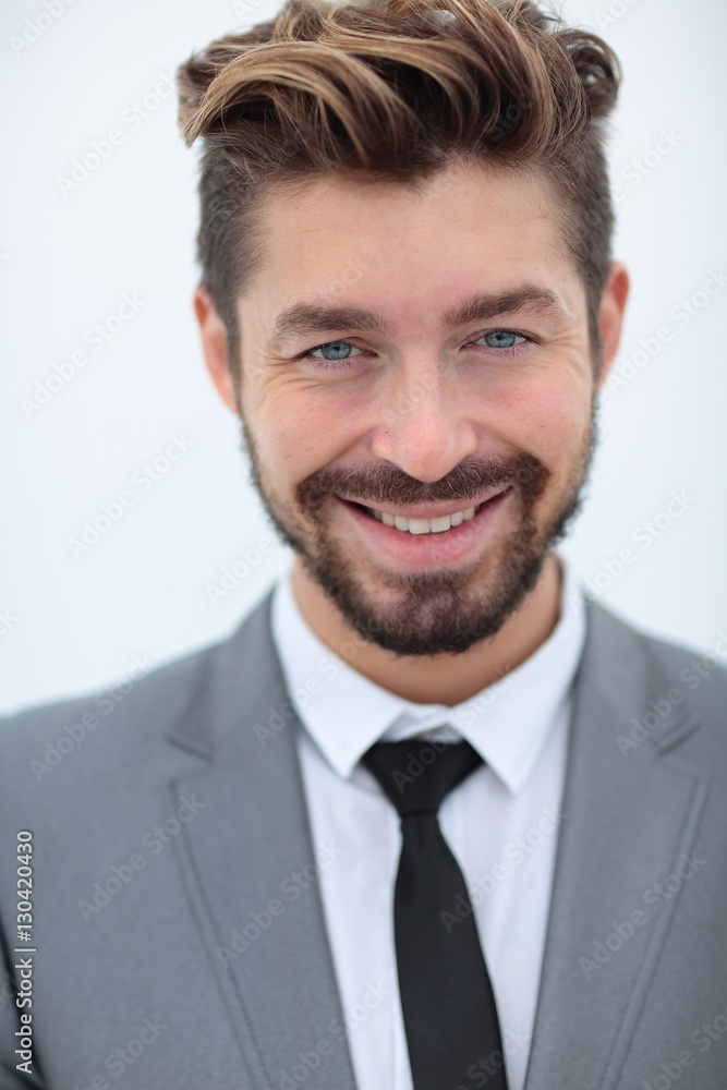 Close up portrait of a smiling handsome business man over white Close up portrait of a smiling handsome business man over white