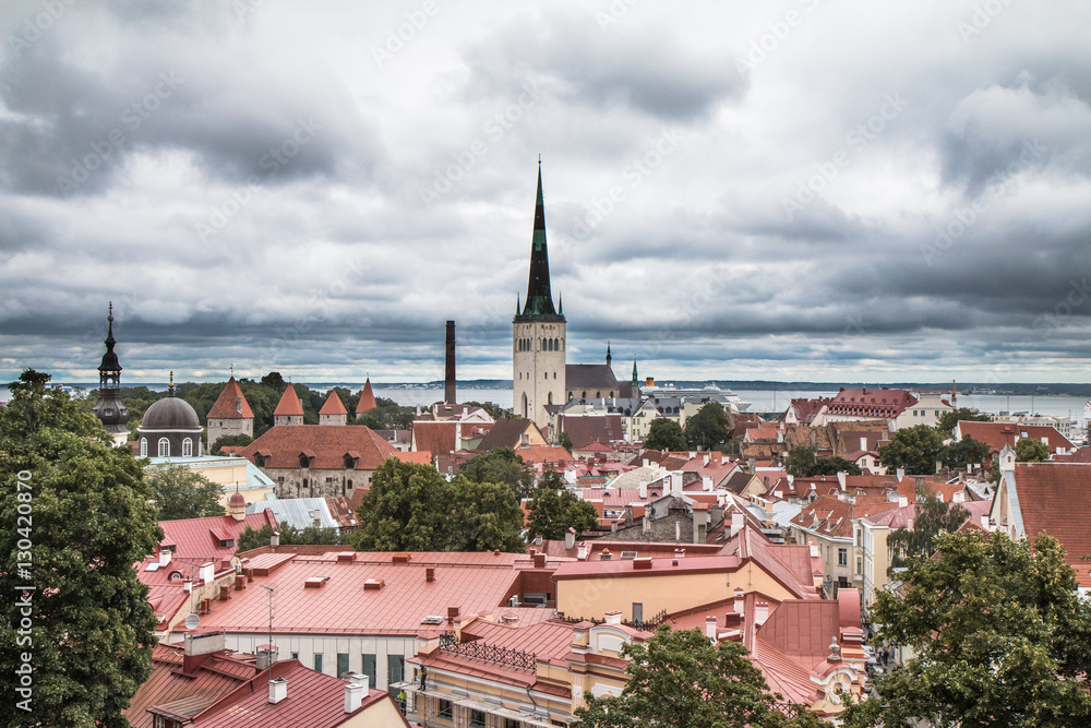 View of the ancient Tallinn old town from a viewing platform on a cloudy day. Tallinn, Estonia.