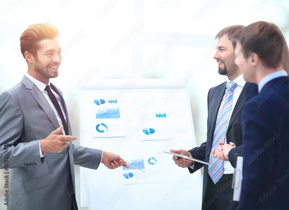 Business team discussing acquisition in meeting Business team discussing acquisition in meeting