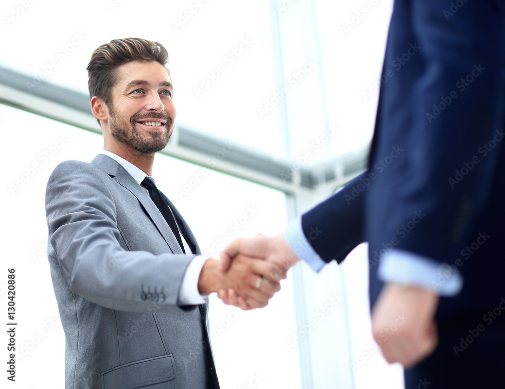 Business colleagues sitting at a table during a meeting with two Business colleagues sitting at a table during a meeting with two