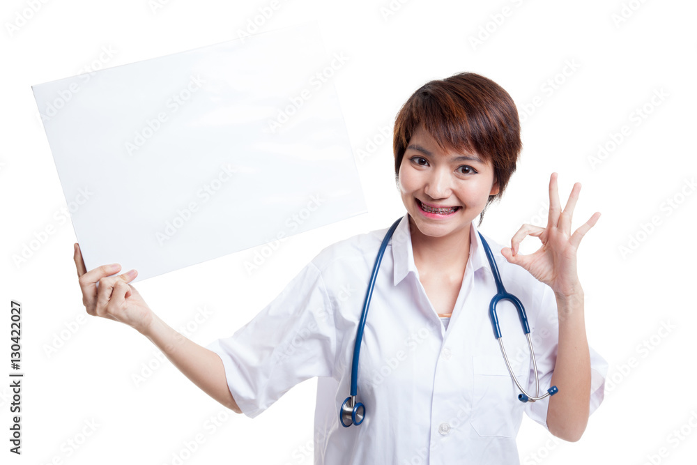 Young Asian female doctor show a blank sign and OK sign. Young Asian female doctor show a blank sign and OK sign.