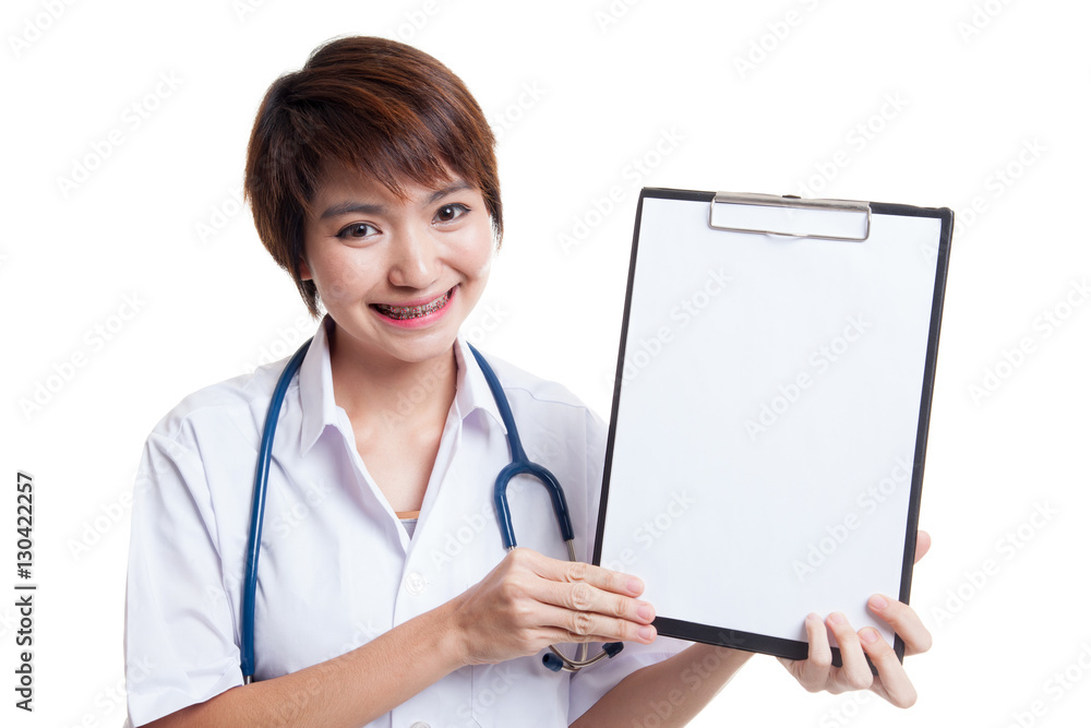 Young Asian female doctor show a blank clipboard. Young Asian female doctor show a blank clipboard.