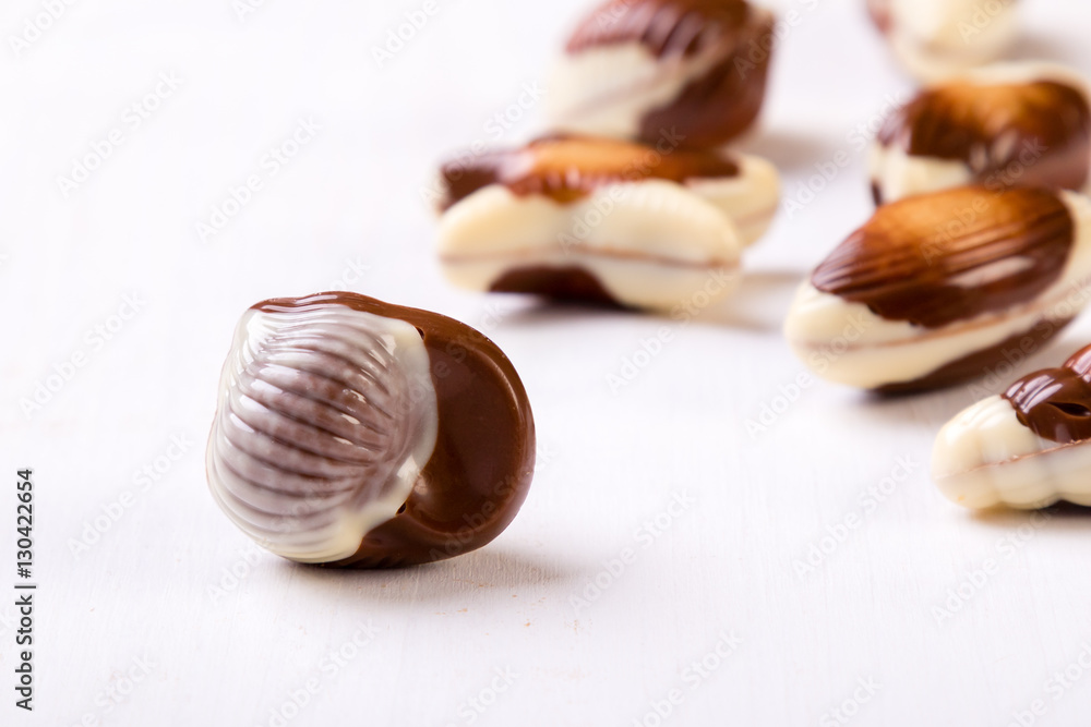 chocolate seashell on white table