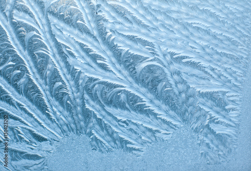 Frosty patterns on glass in winter