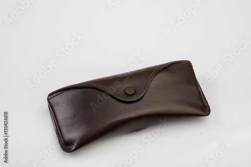 Vintage leather glasses' case over white background isolated.