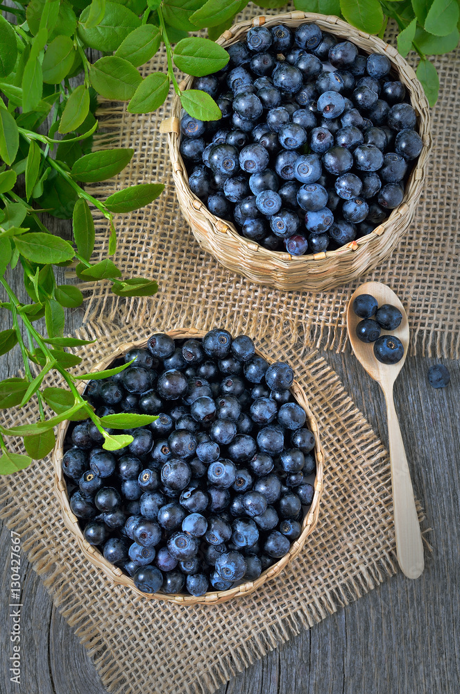 Fresh bilberry in a wicker basket Fresh bilberry in a wicker basket