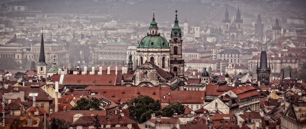 Fototapeta premium Houses with traditional red roofs in Prague. Old Town Square in