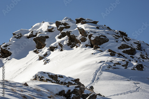 Bild auf Leinwand Beautiful view of rocky peak with snow in Tian-Shan mountain