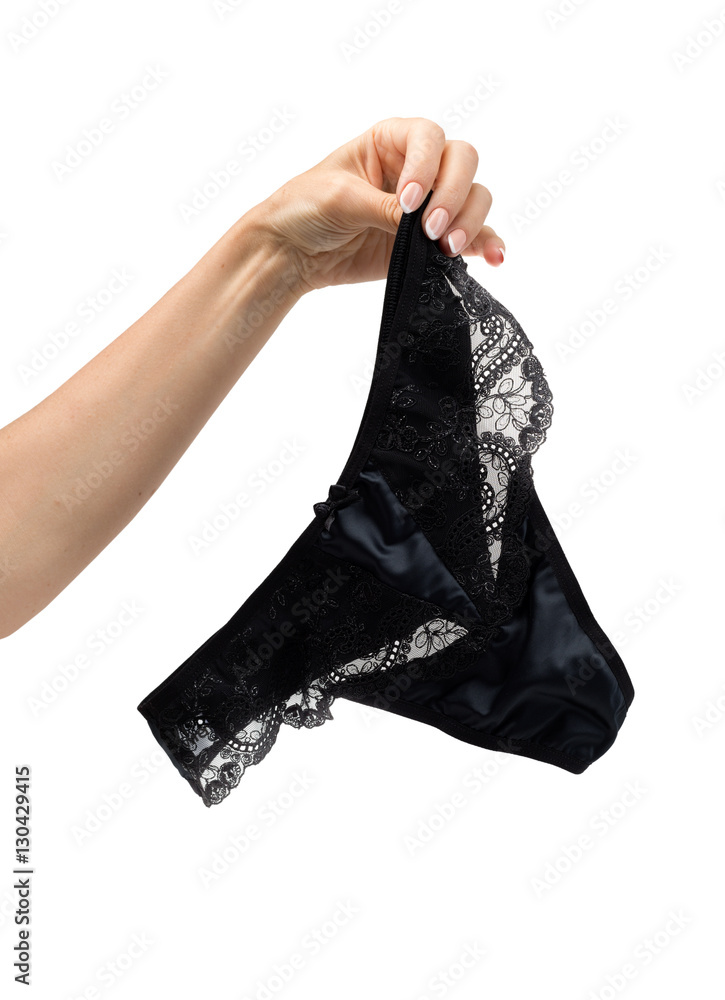 Black lace panties in a female hand Stock Photo