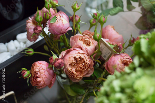 Spring Flowers in a flower shop. Street flower market. Different roses.