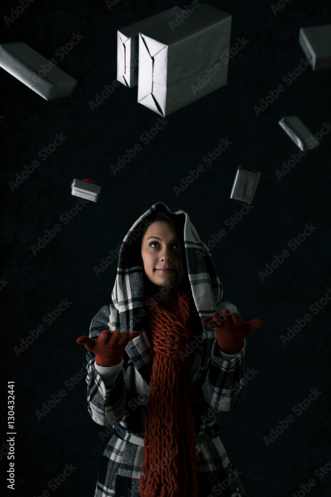 Winter: Woman Throws Stack Of Presents Into The Air Winter: Woman Throws Stack Of Presents Into The Air