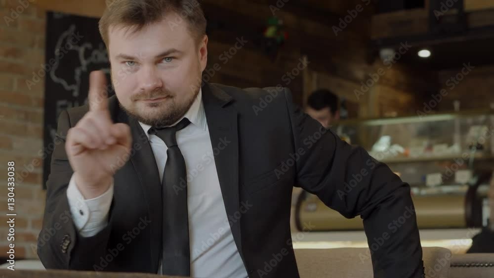Frustrated businessman shows his displeasure Frustrated businessman shows his displeasure