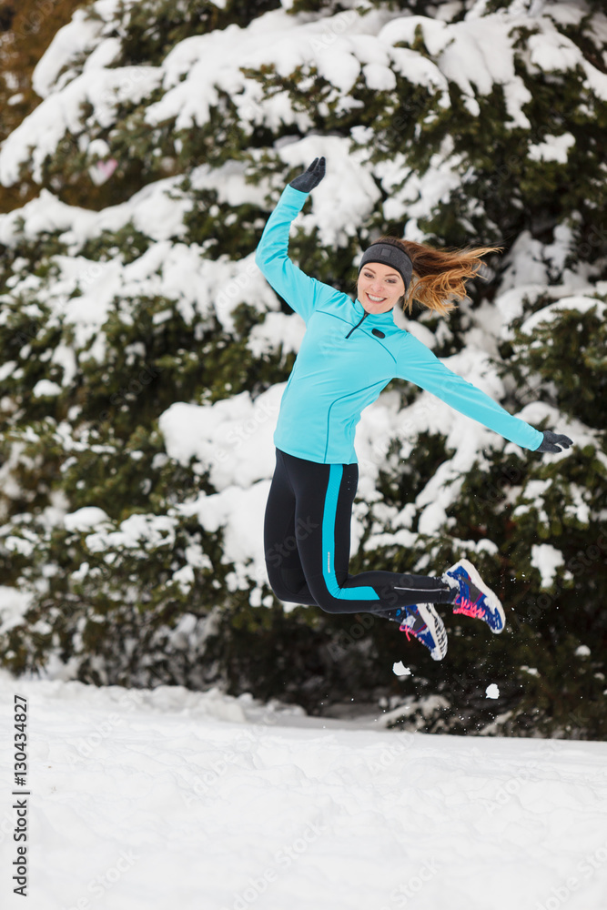 Winter sport, girl jumping in snow