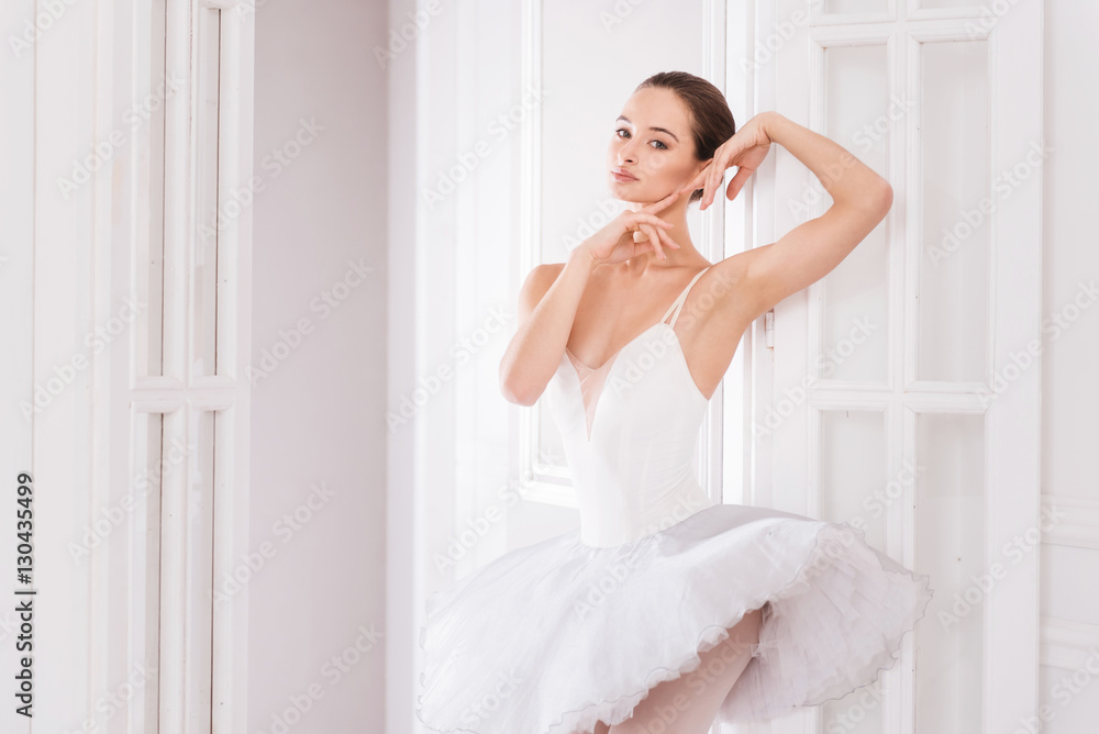 Graceful ballerina touching her face Graceful ballerina touching her face