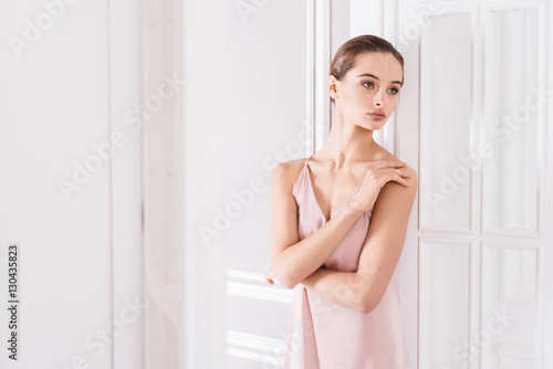 Delicate woman crossing her arms
