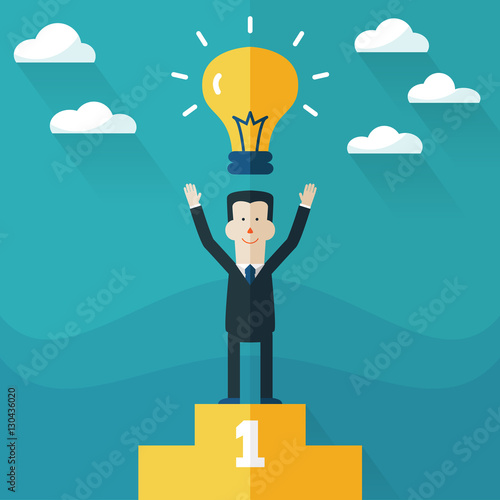 Successful, smiling, young, happy businessman standing on the winning podium