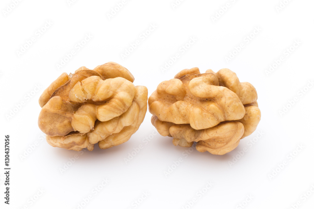 Walnut and walnut kernel isolated on the white background. Walnut and walnut kernel isolated on the white background.