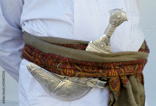 Omani man's khanjar dagger at cultural performance in Muscat in Oman