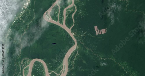 High-altitude overflight aerial of tropical deforestation near the Amazon river in northeastern Peru. Clip loops and is reversible. Elements of this image furnished by USGS/NASA Landsat