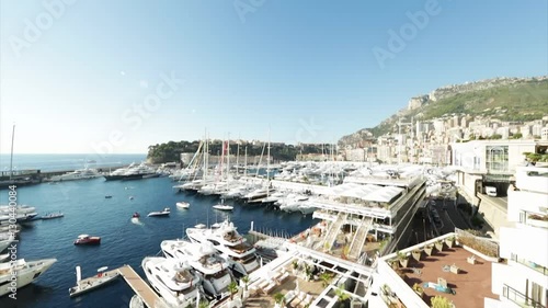 World Fair MYS Monaco Yacht Show, Port Hercules, luxury megayachts, many shuttles, taxi boat, presentations, Journalists, boat traffic, Azur water, aerial view, mountains on background, perspective photo