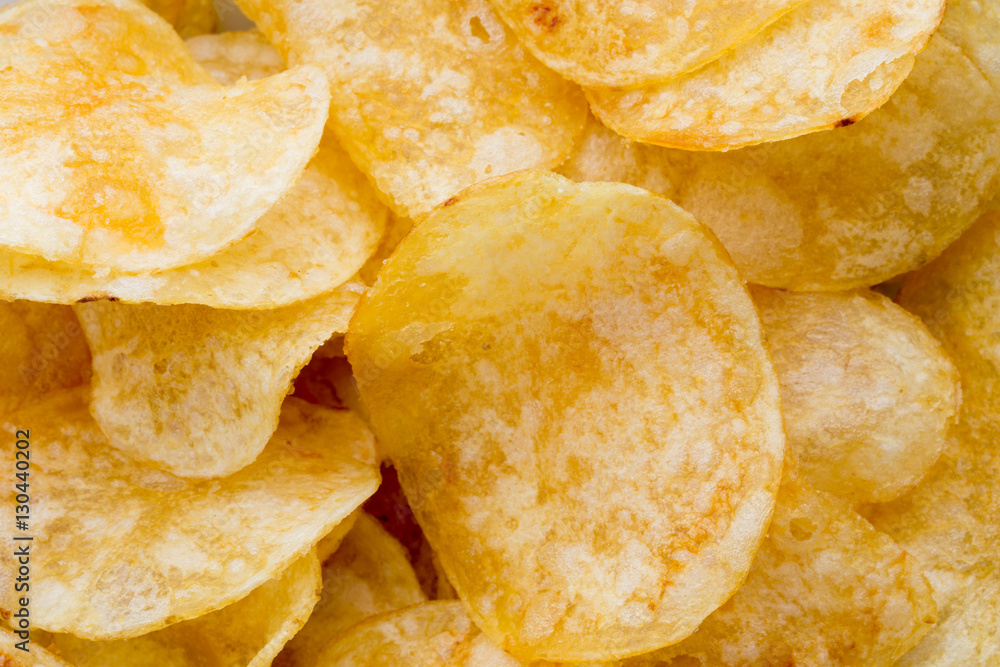 Close up potato chips on wood top view background. Close up potato chips on wood top view background.