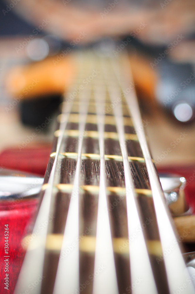 guitar with focus on bottom E string and string-tree. guitar with focus on bottom E string and string-tree.