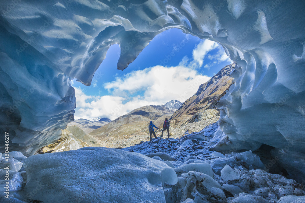 Hikers inside Forni Glacier, Forni Valley, Stelvio National Park, Valtellina, Lombardy Hikers inside Forni Glacier, Forni Valley, Stelvio National Park, Valtellina, Lombardy