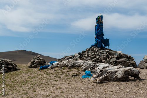 Mongolian ovoo and horse skulls photo