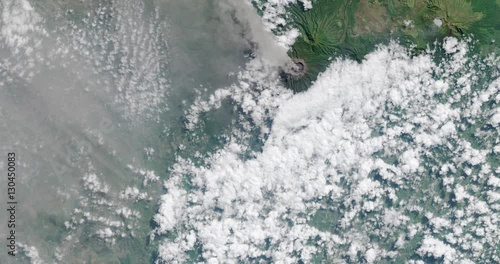 Wallpaper Mural High-altitude overflight aerial of Mount Raung Volcano on the Indonesian island of Java. Clip loops and is reversible. Elements of this image furnished by USGS/NASA Landsat Torontodigital.ca